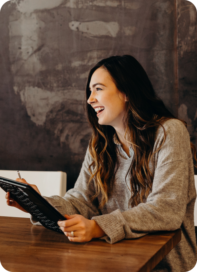 A happy psychologist using Measurely to administer psychological assessments and monitor treatment outcomes.